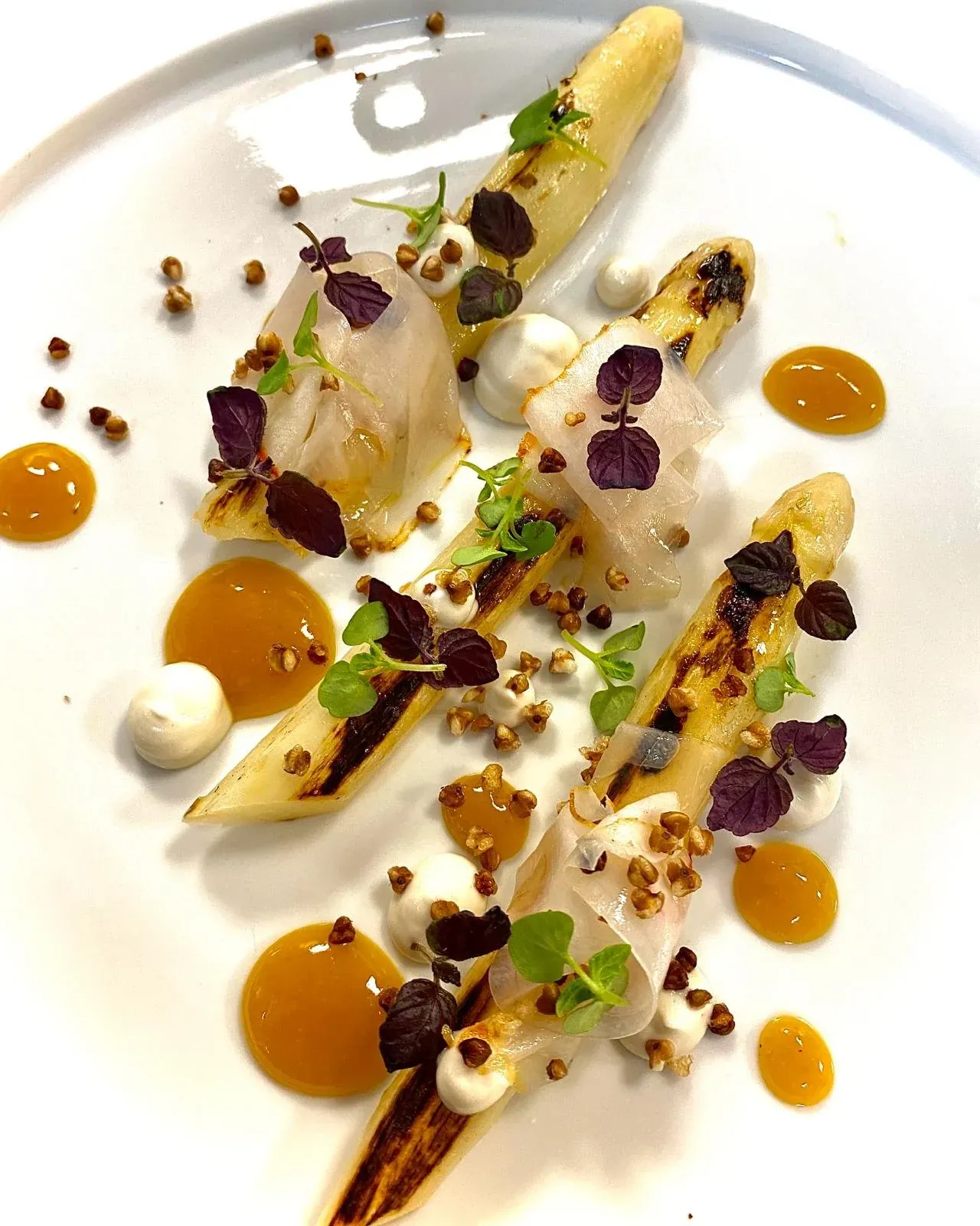 Roasted white asparagus, hazelnuts and orange sauce