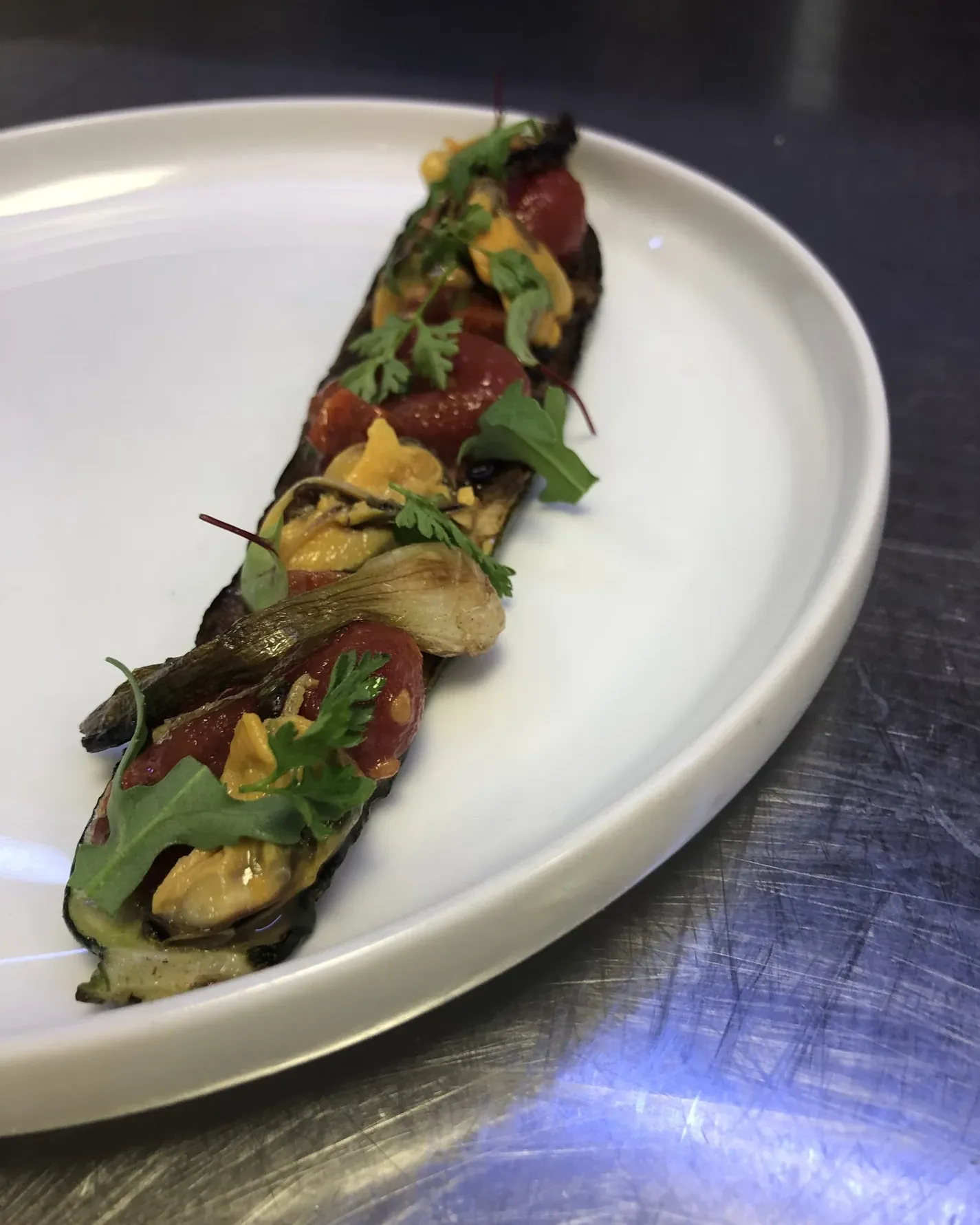 Long-cut grilled aubergine, tomatoes and herbs