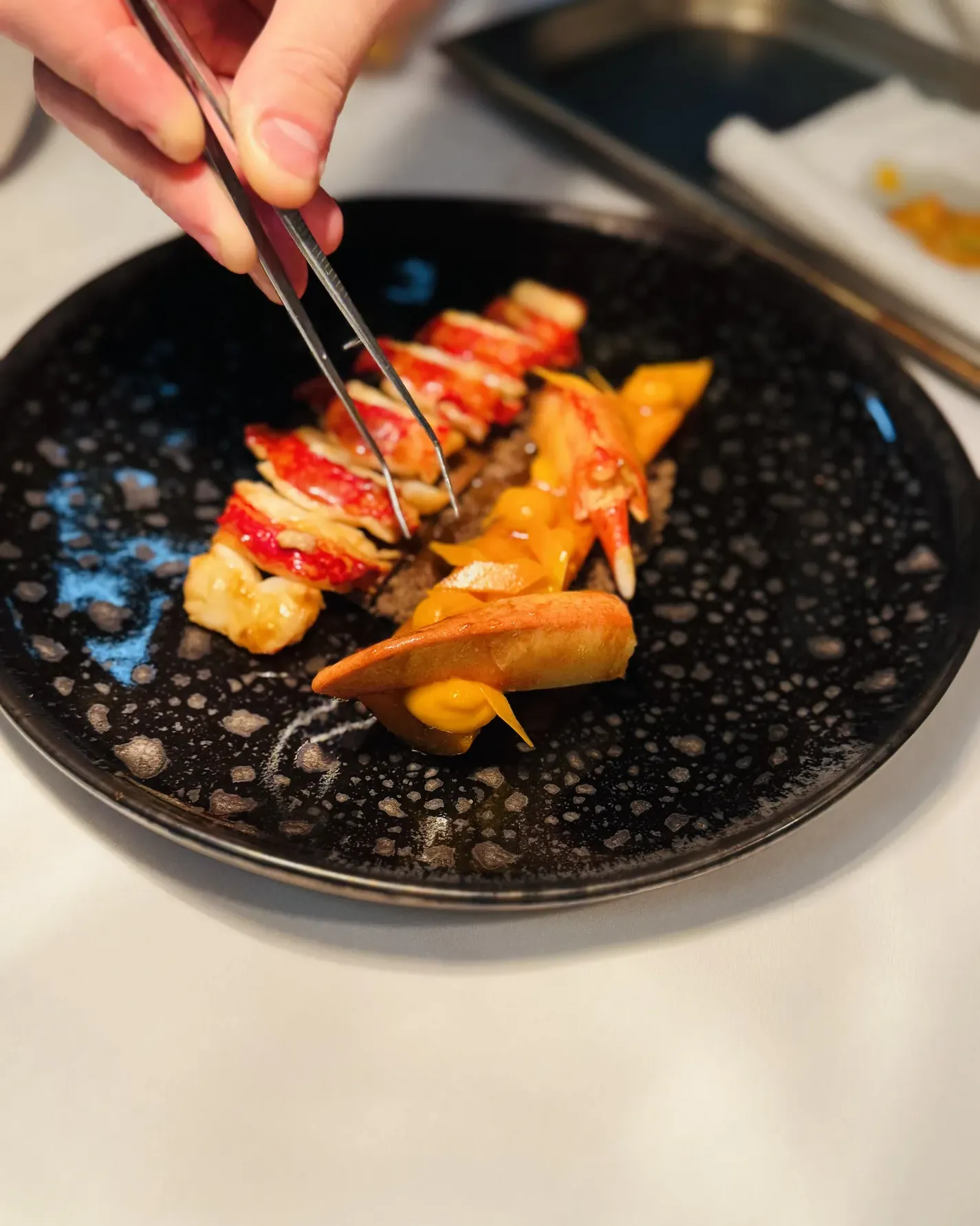 Plating with tweezers: lentils, carrots and shellfish
